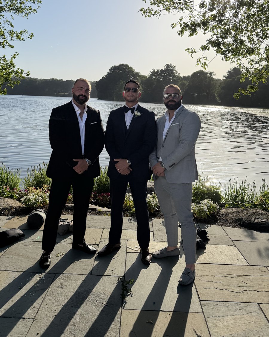 The three founders standing side by side by a lake